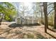 Cozy home featuring a peaceful outdoor space and a charming exterior with a bright double door at 8479 Alden Dr, Riverdale, GA 30274