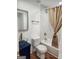 Bathroom featuring modern fixtures, a glass bowl sink, and a tiled shower with a stylish curtain at 95 Mccoy Dr, Carrollton, GA 30116