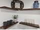 Kitchen detail showcasing floating shelves with decor against a white subway tile backsplash at 95 Mccoy Dr, Carrollton, GA 30116