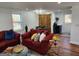 The living room is equipped with a barn door, hardwood floors, and comfortable furniture at 95 Mccoy Dr, Carrollton, GA 30116