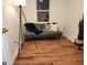 A cozy living room with wood floors and a comfortable green couch at 95 Mccoy Dr, Carrollton, GA 30116