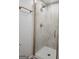 A modern shower with glass doors and gold fixtures at 95 Mccoy Dr, Carrollton, GA 30116