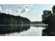 Picturesque lake view with reflections, capturing serene nature at 130 Floss Flower Ct, Roswell, GA 30076