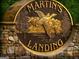 Martin's Landing stone and bronze community sign with ducks at 130 Floss Flower Ct, Roswell, GA 30076