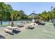Tennis court complex featuring picnic tables and covered gazebo for relaxation and socializing at 130 Floss Flower Ct, Roswell, GA 30076