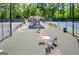Spacious tennis court area with tables, chairs, and a covered pavilion for relaxing between matches at 130 Floss Flower Ct, Roswell, GA 30076