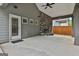 The cozy back porch features a stone fireplace and is perfect for outdoor living at 70 Pacific Ave, Sharpsburg, GA 30277