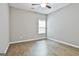 Bright bedroom with hardwood floors and a view of the window at 70 Pacific Ave, Sharpsburg, GA 30277