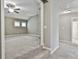 Spacious carpeted bedroom with neutral walls, a ceiling fan, and two windows for ample natural light at 70 Pacific Ave, Sharpsburg, GA 30277