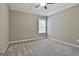 This bedroom features a ceiling fan and a window at 70 Pacific Ave, Sharpsburg, GA 30277