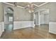 Spacious dining room adjacent to living areas with hardwood floors, coffered ceilings, and an open, airy layout at 70 Pacific Ave, Sharpsburg, GA 30277
