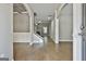 Light-filled foyer featuring hardwood floors, elegant archways, and staircase with iron spindles at 70 Pacific Ave, Sharpsburg, GA 30277