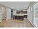 Modern kitchen with a center island, stainless steel appliances, and hardwood flooring at 70 Pacific Ave, Sharpsburg, GA 30277