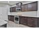 Well-equipped kitchen features granite countertops, stainless steel appliances, and ample cabinet space at 70 Pacific Ave, Sharpsburg, GA 30277