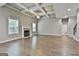 Inviting living room with coffered ceiling, fireplace, and multiple windows for natural light at 70 Pacific Ave, Sharpsburg, GA 30277