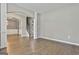Spacious living room featuring hardwood floors, stylish archway, and stairs leading to upper level at 70 Pacific Ave, Sharpsburg, GA 30277