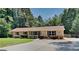 Charming single-story home with a cozy front porch and mature trees at 11953 Brown Bridge Rd, Covington, GA 30016