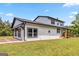 This country farmhouse features a covered wooden porch and a spacious yard at 2955 Peeksville Rd, Locust Grove, GA 30248