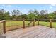 Wooden deck with backyard views and wire fencing around the wood railing at 2955 Peeksville Rd, Locust Grove, GA 30248