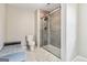 Bathroom featuring a modern shower and toilet with tile flooring and a gray bench at 2955 Peeksville Rd, Locust Grove, GA 30248