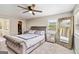 Main bedroom offering a decorative mirror and ceiling fan with a walk-in closet at 2955 Peeksville Rd, Locust Grove, GA 30248