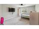Bedroom offers a ceiling fan and neutral walls with gray carpet flooring at 2955 Peeksville Rd, Locust Grove, GA 30248