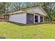 Large detached garage with multiple bays and screen doors providing ample space for parking and storage at 2955 Peeksville Rd, Locust Grove, GA 30248