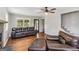 Cozy living room with hardwood floors, fireplace, and comfortable leather furniture at 2955 Peeksville Rd, Locust Grove, GA 30248