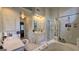 Bright bathroom featuring a soaking tub, glass-enclosed shower, and dual vanities with abundant counter space at 303 Sedgewick Trl, Lawrenceville, GA 30044