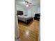 Well-lit bedroom with neutral paint, hardwood floors, and ample closet space at 303 Sedgewick Trl, Lawrenceville, GA 30044