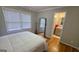 Comfortable bedroom with hardwood floors, and ensuite bathroom with modern fixtures at 303 Sedgewick Trl, Lawrenceville, GA 30044