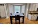 Dining area featuring a large window with natural light next to the kitchen at 303 Sedgewick Trl, Lawrenceville, GA 30044