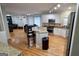Open kitchen with granite countertops, stainless steel appliances and hardwood floors at 303 Sedgewick Trl, Lawrenceville, GA 30044