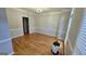 Bright living room showcasing elegant wainscoting, hardwood floors, and a neutral color palette at 303 Sedgewick Trl, Lawrenceville, GA 30044