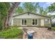 This backyard features a patio with chairs and a lush lawn at 2364 Woodside Way, Atlanta, GA 30341