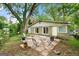 Backyard patio with outdoor seating surrounded by lush greenery at 2364 Woodside Way, Atlanta, GA 30341