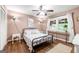Comfortable bedroom with wood floors, soft lighting and a window providing natural light at 2364 Woodside Way, Atlanta, GA 30341