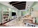 Charming living room featuring exposed ceiling beams, hardwood floors, and a comfortable seating area at 2364 Woodside Way, Atlanta, GA 30341