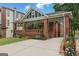 Charming brick bungalow with a welcoming front porch, beautiful landscaping, and a spacious driveway at 537 Winton Ne Ter, Atlanta, GA 30308