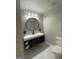 Modern bathroom with marble floors, floating vanity, and sleek fixtures at 783 Lost Creek Cir, Stone Mountain, GA 30088