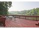 Spacious deck, furnished with outdoor seating, overlooks the serene lake views at 783 Lost Creek Cir, Stone Mountain, GA 30088