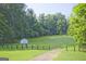 A lush green field offers a playground and ample space for recreation in this Mainstreet community at 783 Lost Creek Cir, Stone Mountain, GA 30088