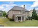 Spacious backyard with screened-in porch, patio, and well-manicured lawn at 4769 Moon Hollow Ct, Buford, GA 30519