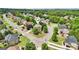 Aerial view of beautiful home with mature trees in a well kept neighborhood on a sunny day at 1979 Alcovy Shoals Blf, Lawrenceville, GA 30045