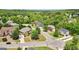 Aerial view of beautiful homes with mature trees in a well kept neighborhood on a sunny day at 1979 Alcovy Shoals Blf, Lawrenceville, GA 30045