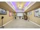 Finished basement with a large projector screen and recessed lighting with colored led lighting at 1979 Alcovy Shoals Blf, Lawrenceville, GA 30045