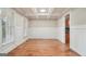 Bright, elegant dining room with coffered ceilings, hardwood floors and wainscoting at 1979 Alcovy Shoals Blf, Lawrenceville, GA 30045