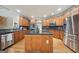 Spacious kitchen with granite countertops, stainless steel appliances, and a large center island at 1979 Alcovy Shoals Blf, Lawrenceville, GA 30045