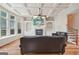 Inviting living room with coffered ceilings, a stone fireplace and a comfortable leather sofa at 1979 Alcovy Shoals Blf, Lawrenceville, GA 30045