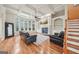 Inviting living room with a fireplace, built-in shelves, coffered ceilings and gleaming wood floors at 1979 Alcovy Shoals Blf, Lawrenceville, GA 30045